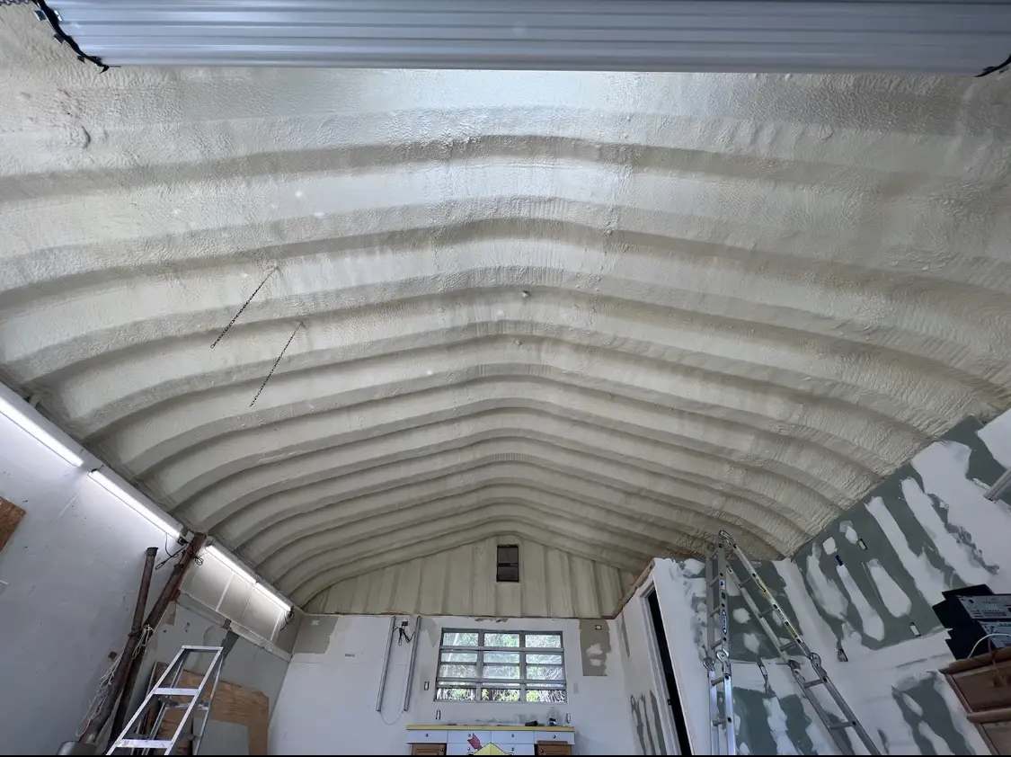 Spray polyurethane foam applied to the underside of a metal roof deck in Dakota Ridge